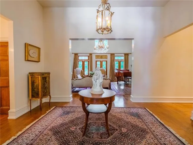 a bedroom with furniture and a chandelier