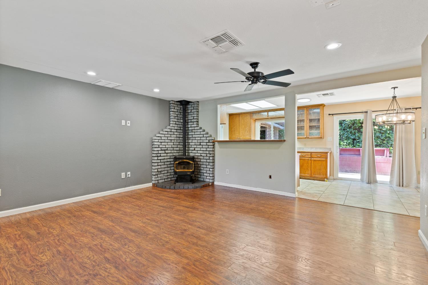 2971 Letitia Avenue Placerville, CA 95667 - Photo 64 of 65 an empty room with windows and chandelier fan