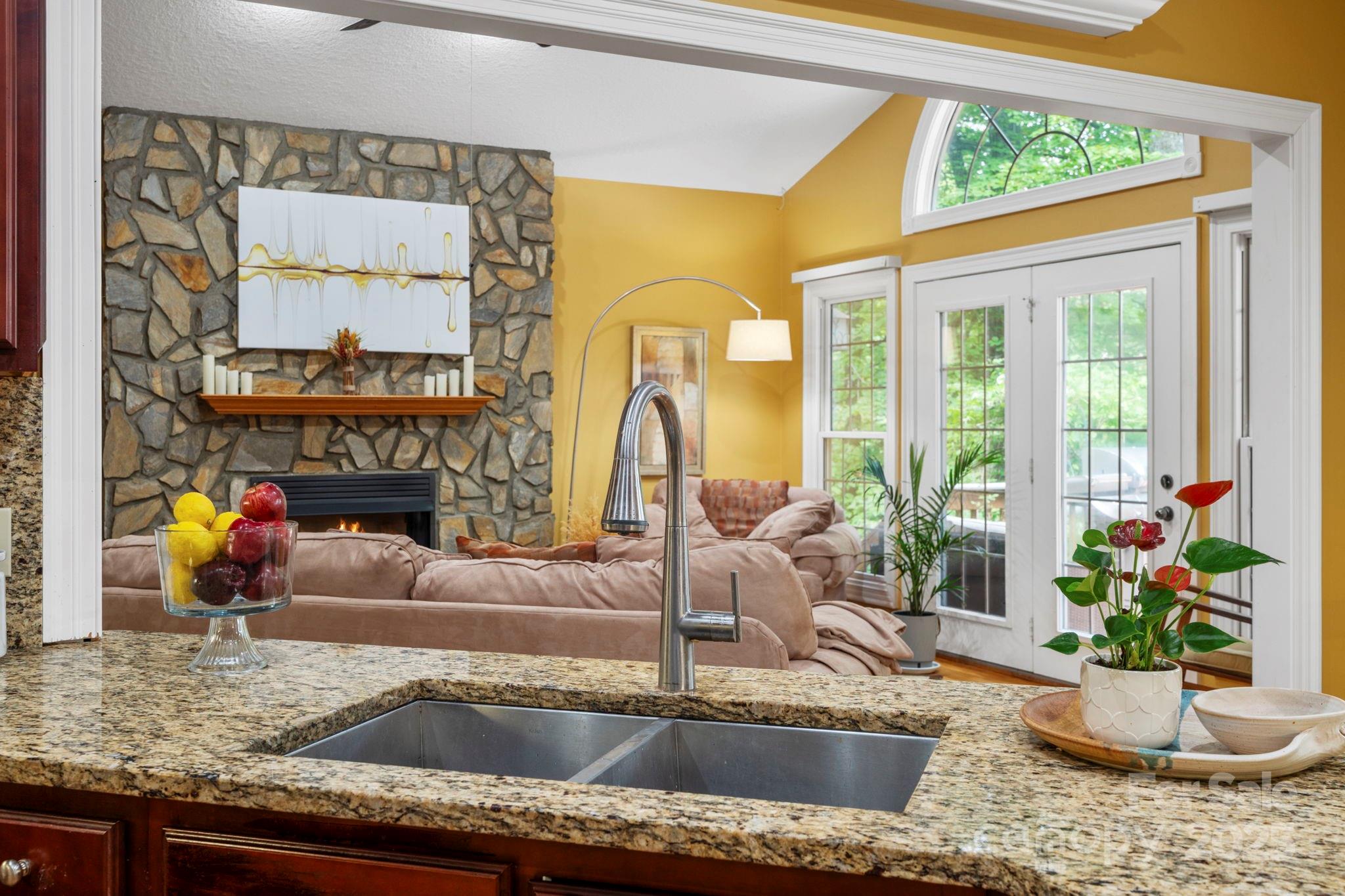 458 Blue Mist Way Arden, NC 28704 - Photo 17 of 47 a kitchen with a granite countertop sink and a large window