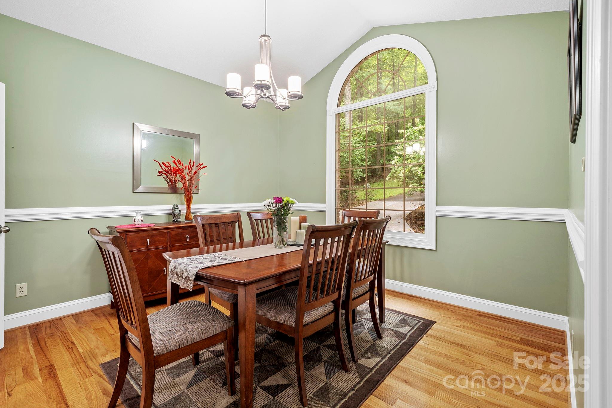 458 Blue Mist Way Arden, NC 28704 - Photo 18 of 47 a view of a dining room with furniture window and wooden floor