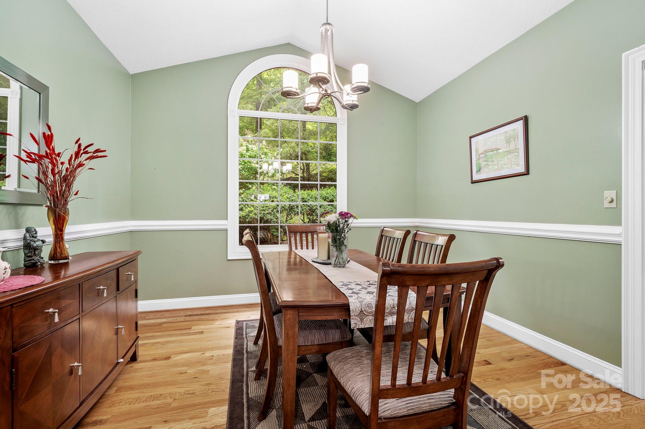458 Blue Mist Way Arden, NC 28704 - Photo 19 of 47 a view of a dining room with furniture and a chandelier