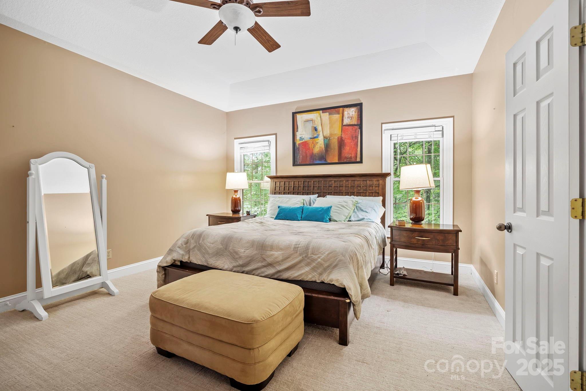 458 Blue Mist Way Arden, NC 28704 - Photo 21 of 47 a bedroom with a bed and a chandelier