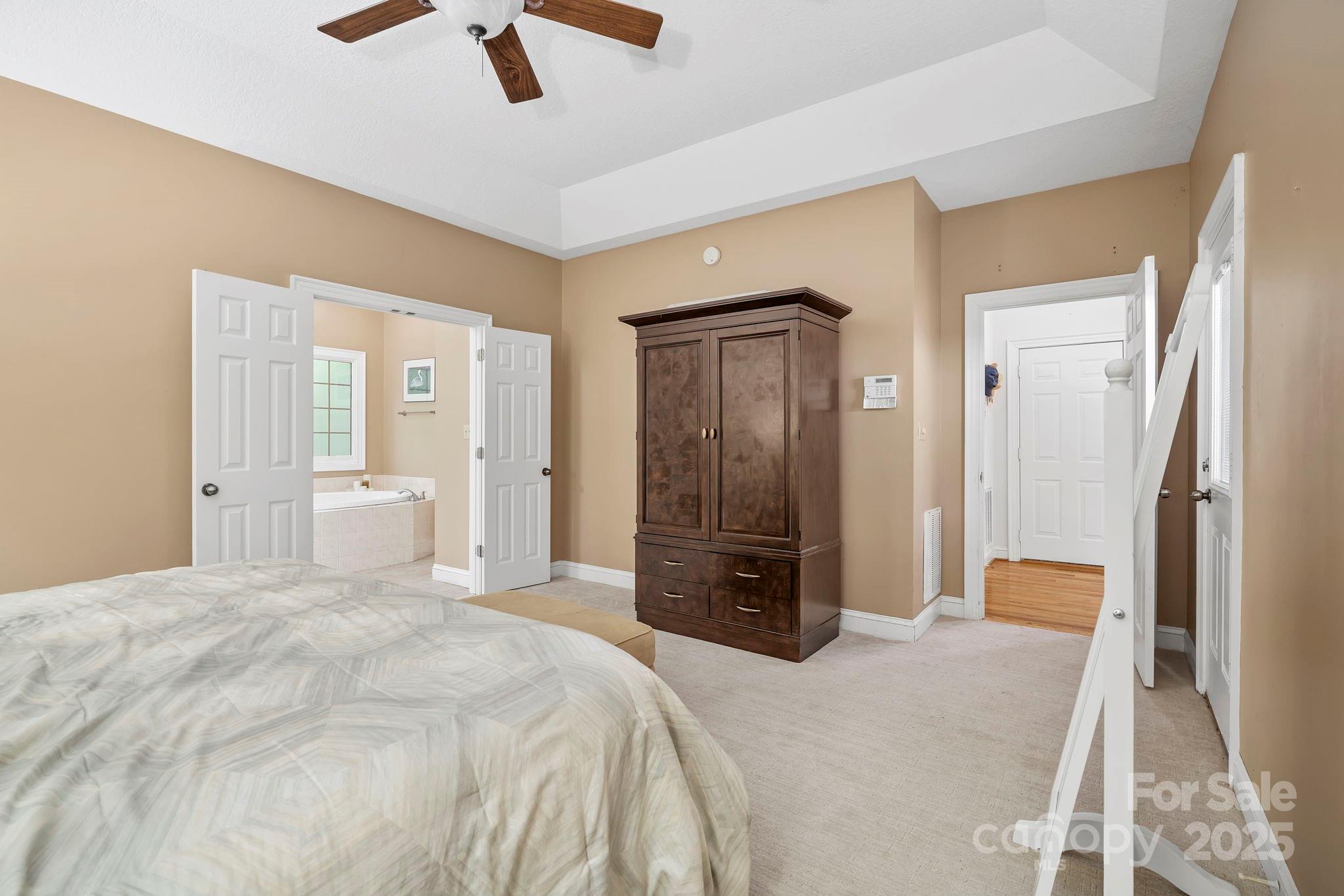 458 Blue Mist Way Arden, NC 28704 - Photo 22 of 47 a bedroom with a bed and a dresser