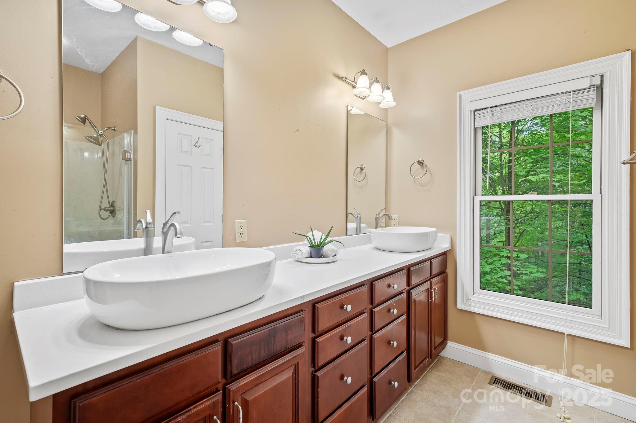 458 Blue Mist Way Arden, NC 28704 - Photo 24 of 47 a bathroom with a sink double vanity and a mirror