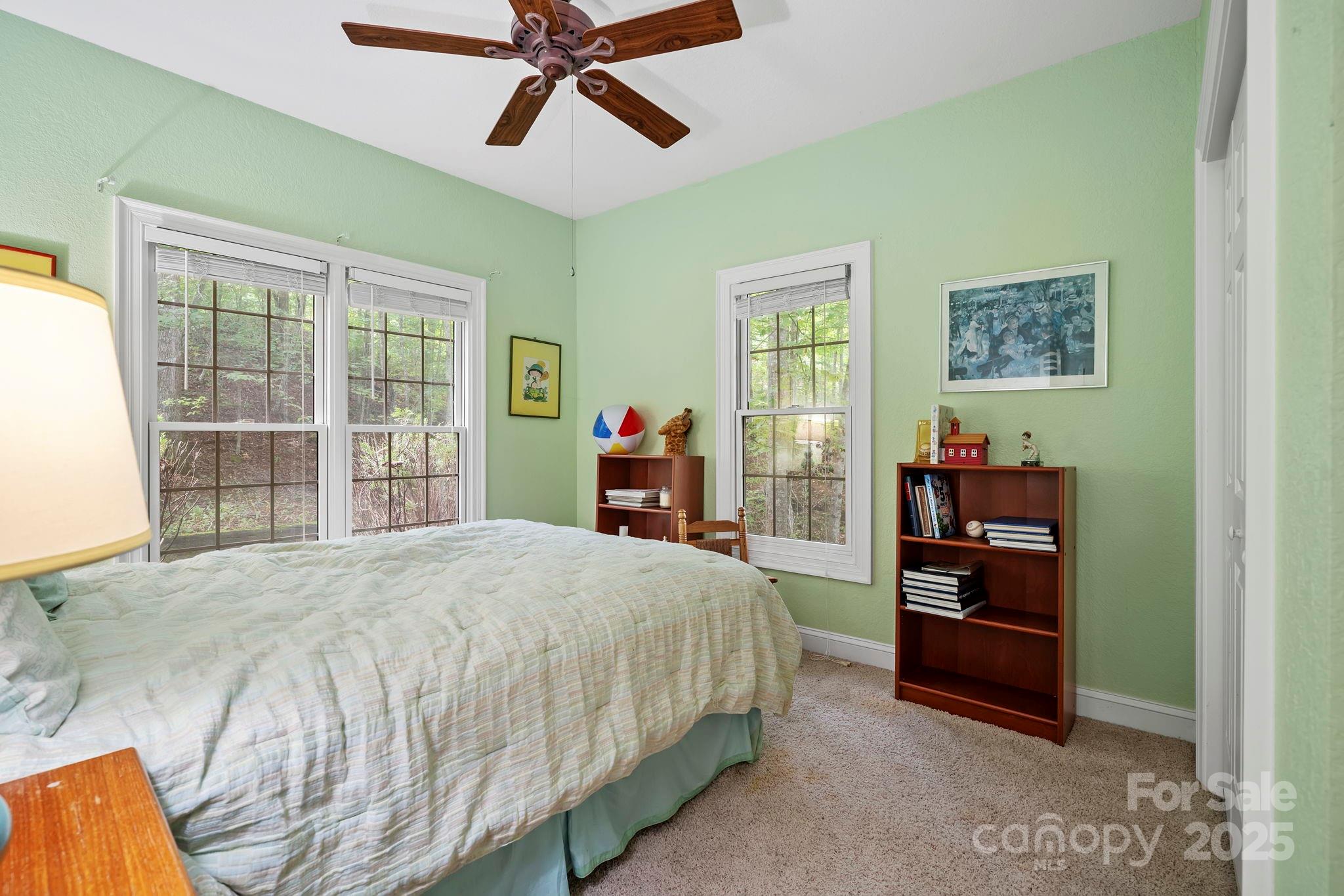 458 Blue Mist Way Arden, NC 28704 - Photo 31 of 47 a bedroom with a bed and a window