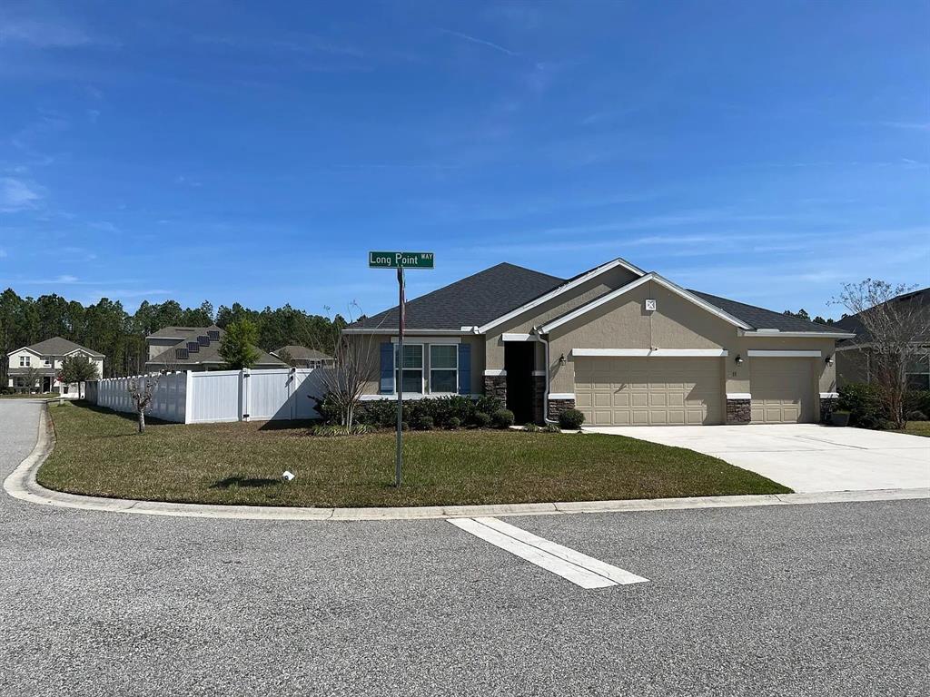 11 Long Point Way St. Augustine, FL 32092 - Photo 2 of 15 a front view of a house with a yard