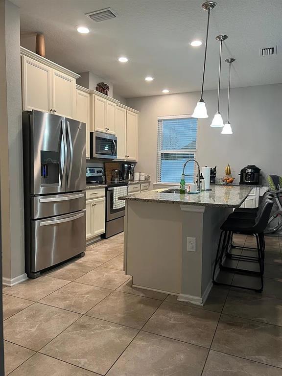 11 Long Point Way St. Augustine, FL 32092 - Photo 5 of 15 a kitchen with kitchen island a counter top space appliances and cabinets