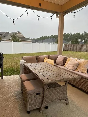 a living room with furniture and a window