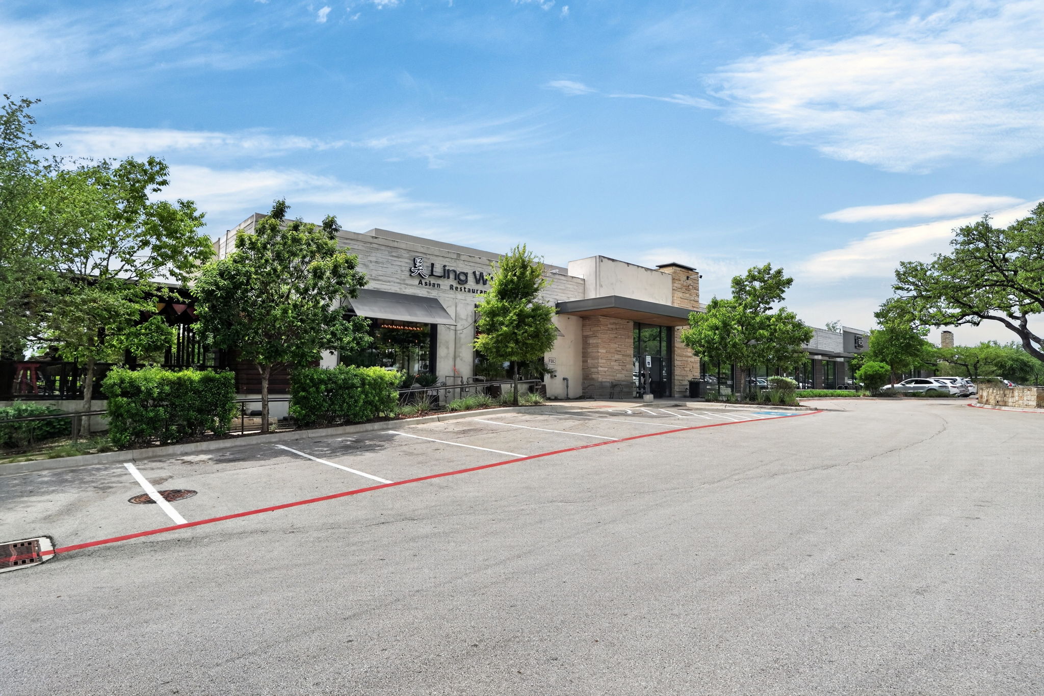 7701 Rialto Boulevard, Unit 91 Austin, TX 78735 - Photo 35 of 39 a front view of a house with a yard and garage