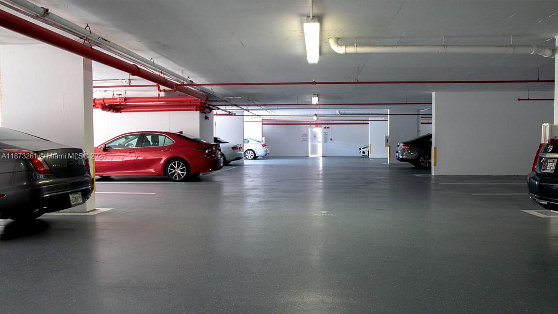 18100 North Bay Road, Unit 509 Sunny Isles Beach, FL 33160 - Photo 11 of 14 a car parked in parking area