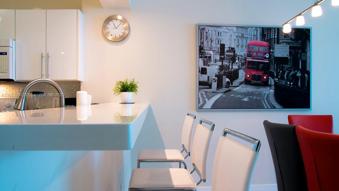 18100 North Bay Road, Unit 509 Sunny Isles Beach, FL 33160 - Photo 7 of 14 a view of living room with furniture and wooden floor