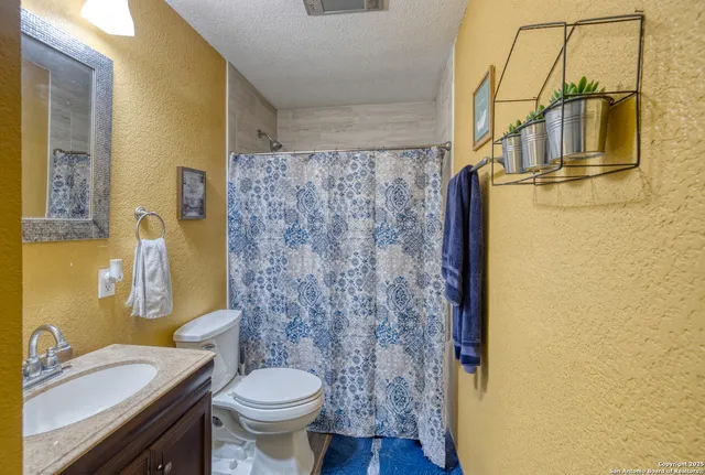 a bathroom with a sink and toilet