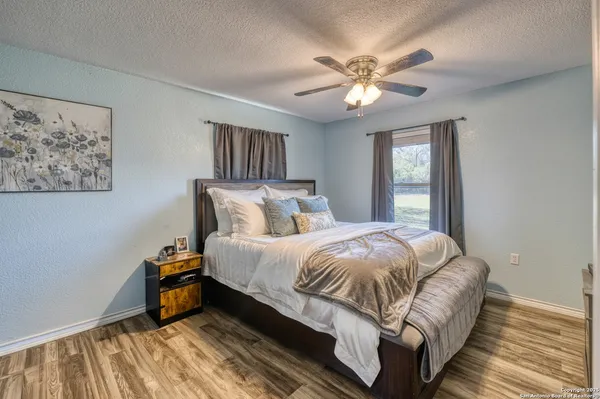 a bedroom with bed and window