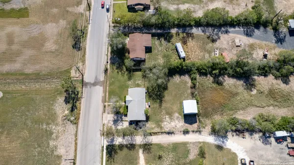 an aerial view of a house with a lake view