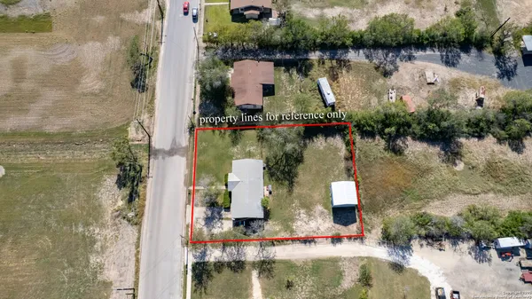 an aerial view of a house with a lake view