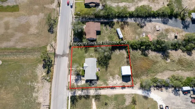 an aerial view of a house with a lake view