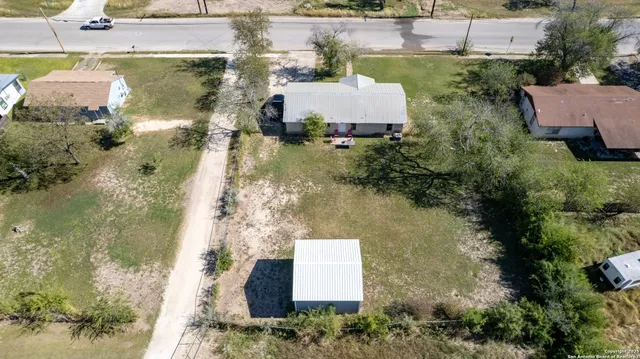 an aerial view of residential houses with outdoor space