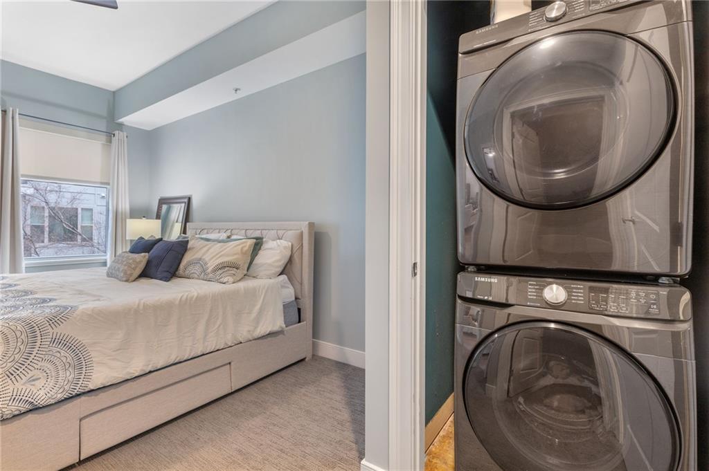 201 West Ponce De Leon Avenue, Unit 35 Decatur, GA 30030 - Photo 13 of 42 a bed room with a bed and a washer