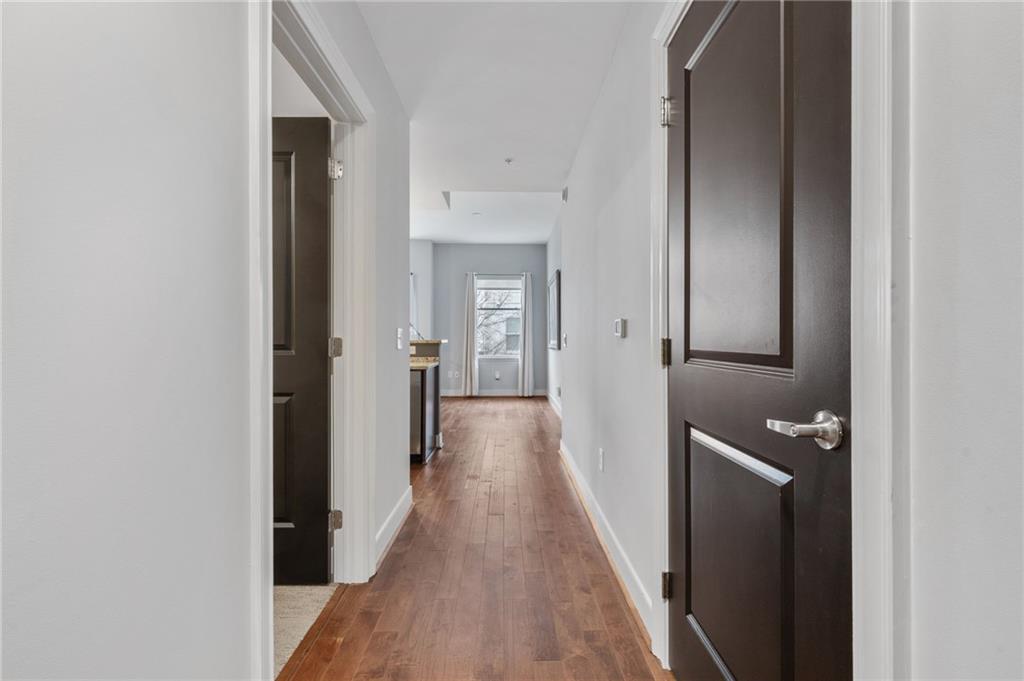 201 West Ponce De Leon Avenue, Unit 35 Decatur, GA 30030 - Photo 2 of 42 a view of hallway with wooden floor