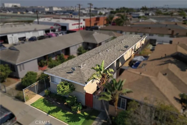 an aerial view of a house with a yard basket ball court and outdoor seating