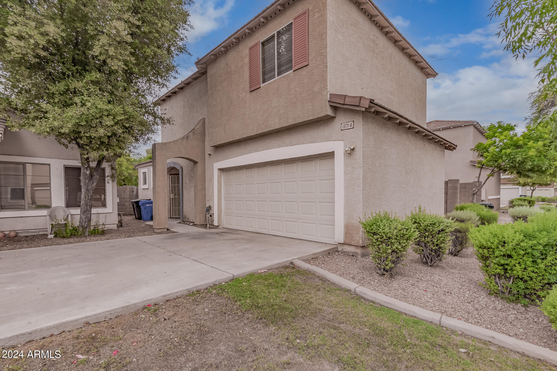 1371 South Boulder Street, Unit A Gilbert, AZ 85296 - Photo 3 of 43 a view of a house with a street