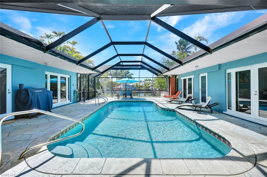 1550 Sandpiper Street Naples, FL 34102 - Photo 22 of 34 a view of swimming pool with seating area