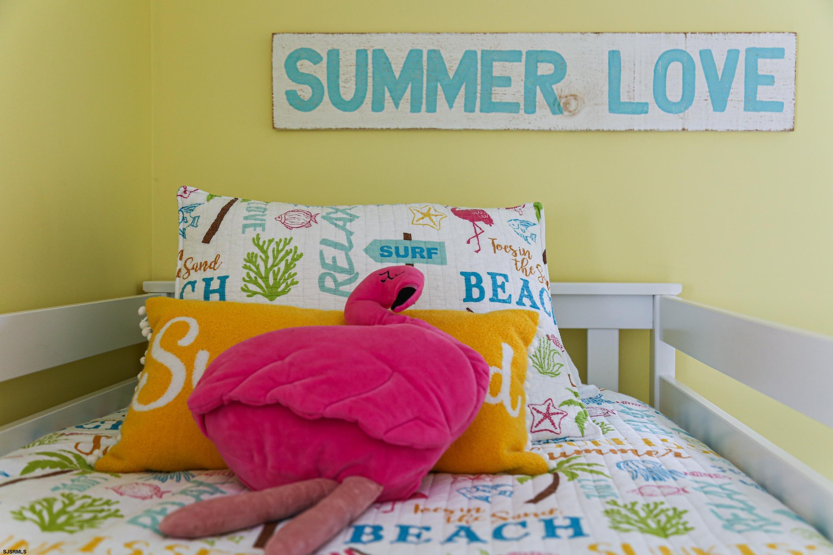 8 44th Cove Brigantine, NJ 08203 - Photo 19 of 57 a bedroom with a bed and a bed