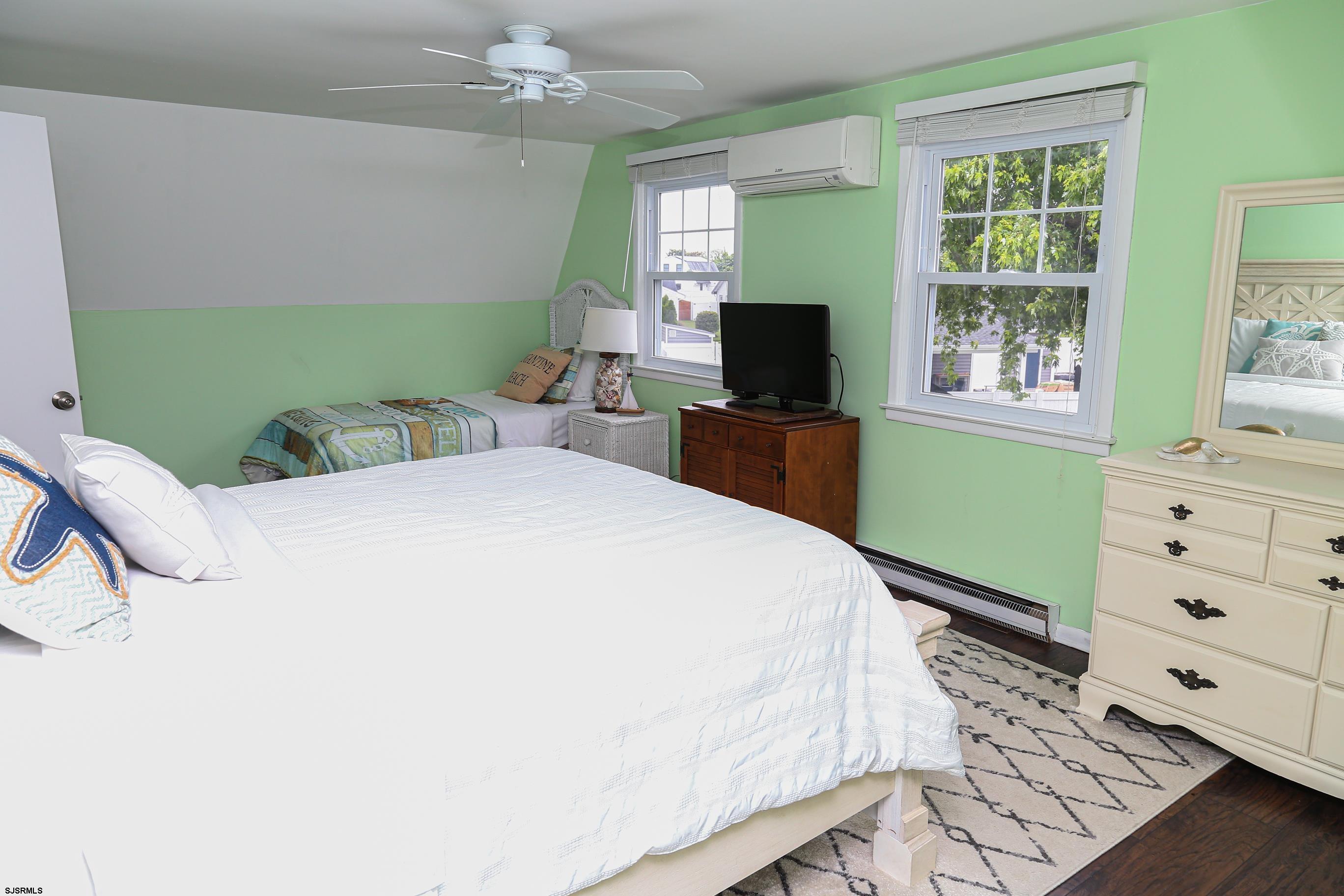 8 44th Cove Brigantine, NJ 08203 - Photo 28 of 57 a bedroom with a bed and a television