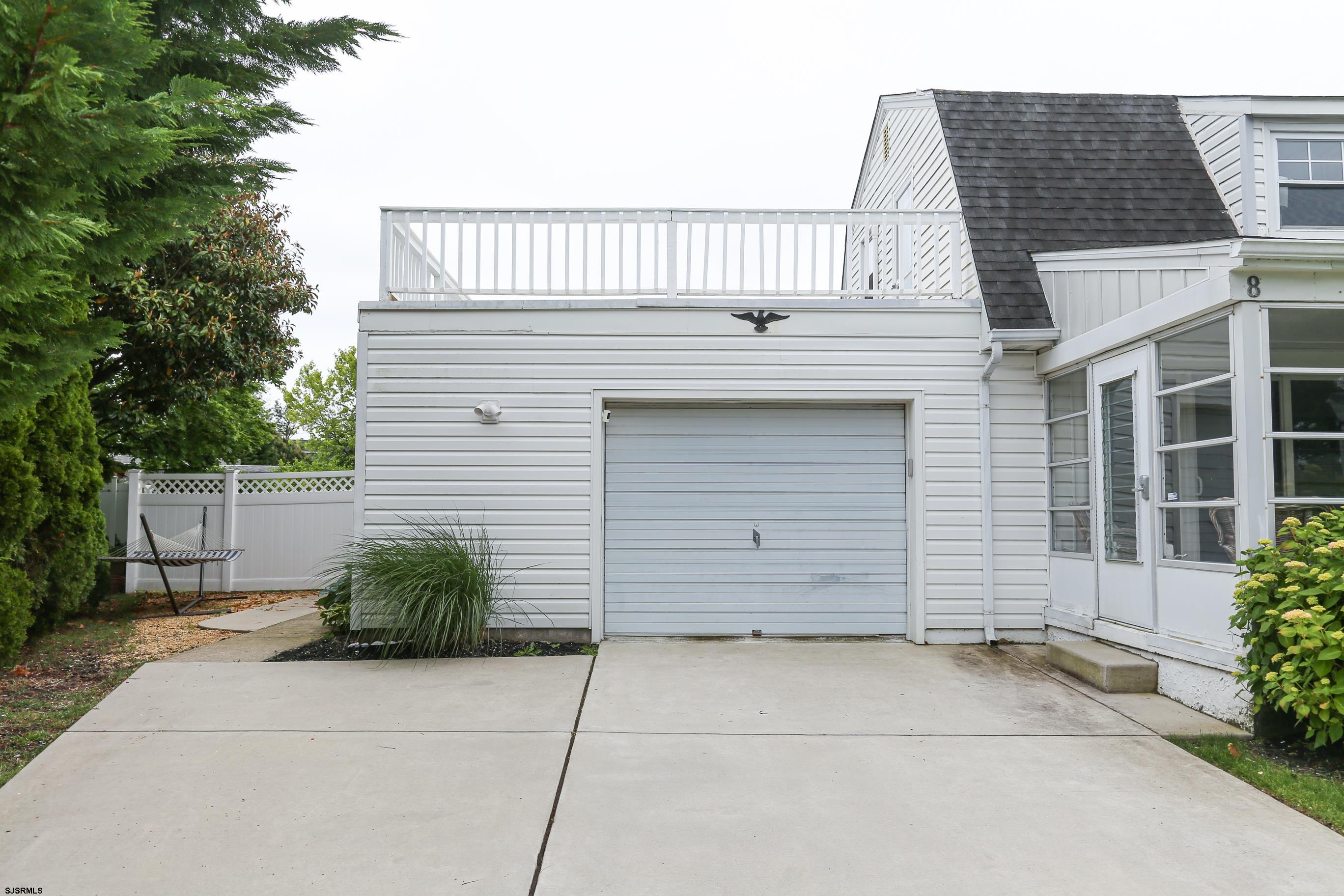 8 44th Cove Brigantine, NJ 08203 - Photo 3 of 57 a view of a house with a garage