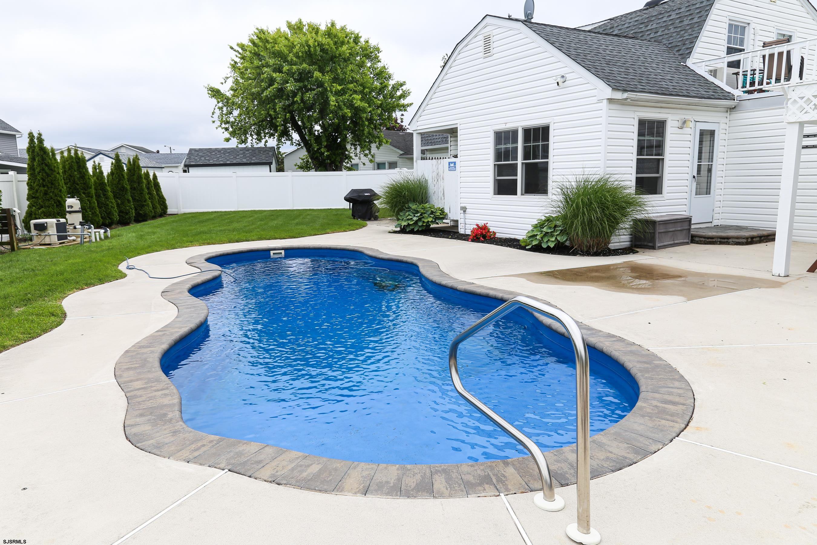 8 44th Cove Brigantine, NJ 08203 - Photo 41 of 57 a view of a backyard with swimming pool