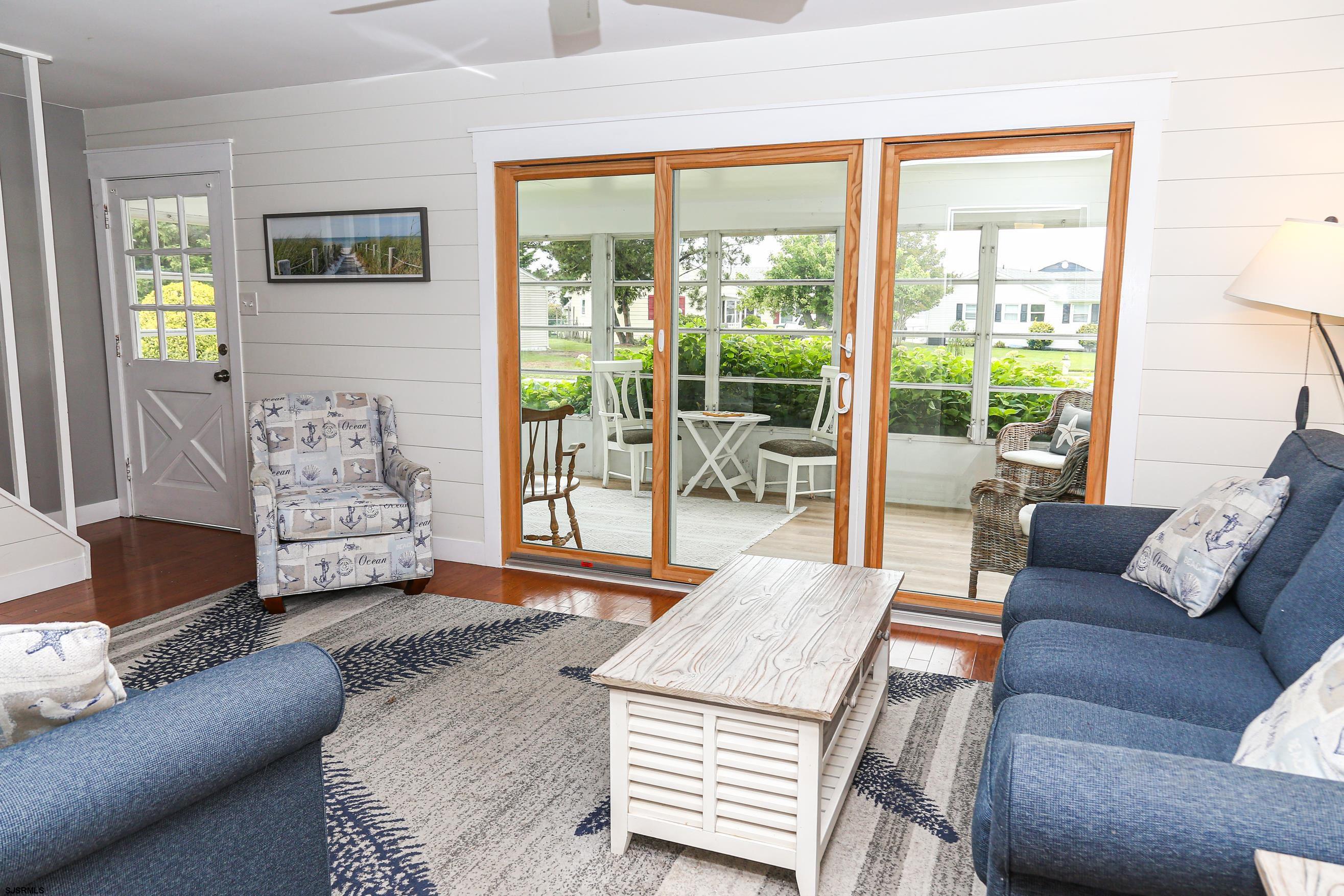 8 44th Cove Brigantine, NJ 08203 - Photo 9 of 57 a living room with furniture and a fireplace
