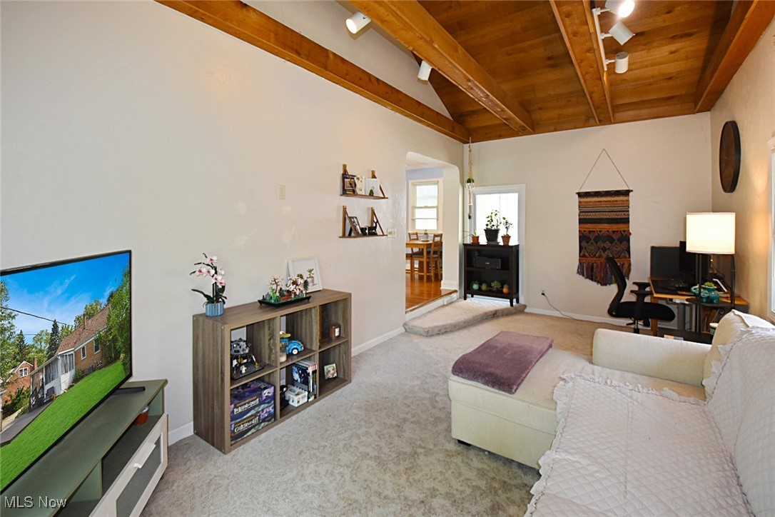 1388 Ford Road Lyndhurst, OH 44124 - Photo 14 of 39 Living room featuring wood ceiling, carpet, beam ceiling, and track lighting