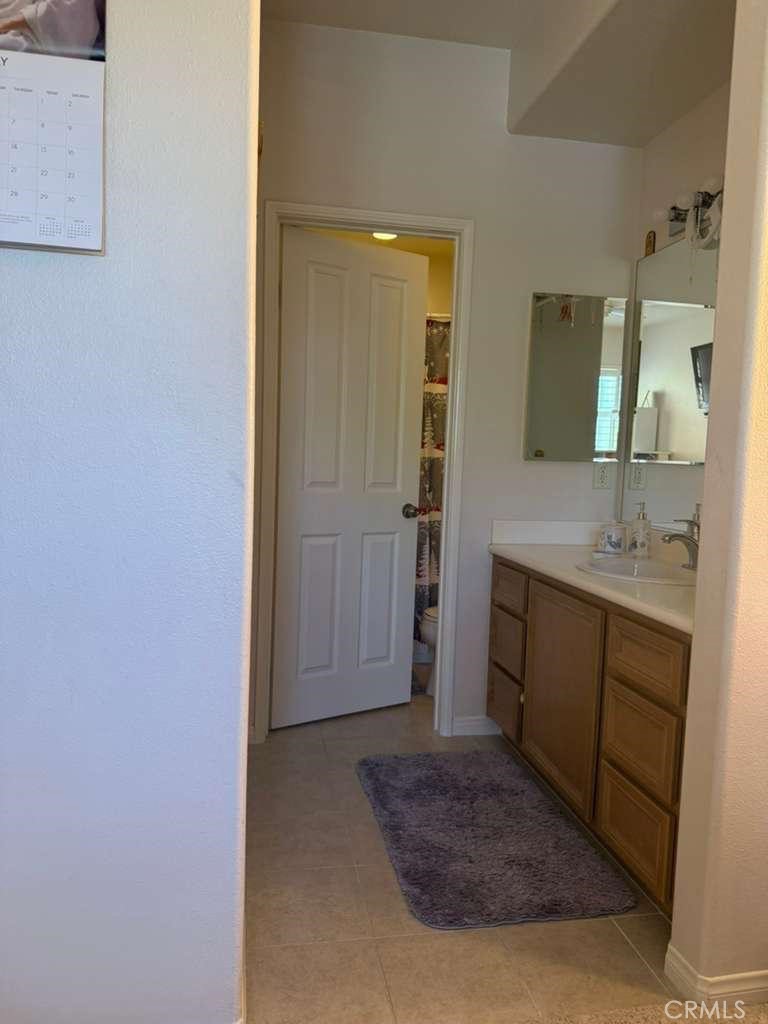 2931 Esperanza Way, Unit B Simi Valley, CA 93063 - Photo 43 of 49 a bathroom with a sink and a mirror