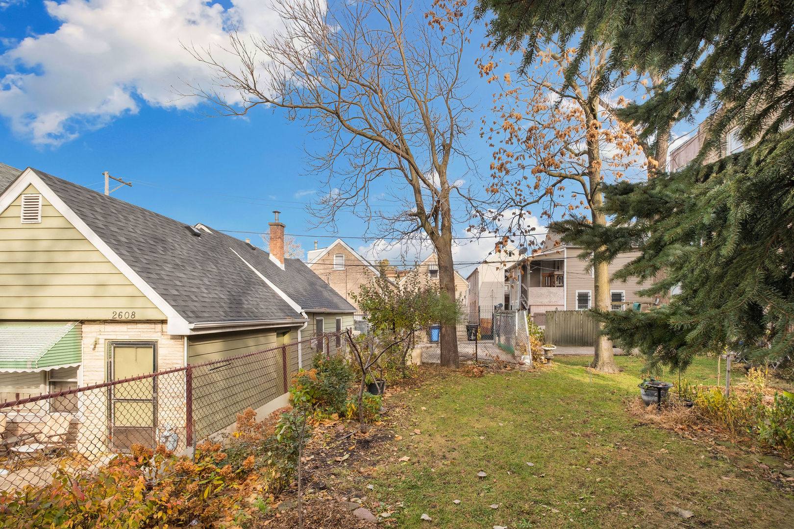 2606 West 24th Place Chicago, IL 60608 - Photo 4 of 6 a backyard of a house with lots of green space