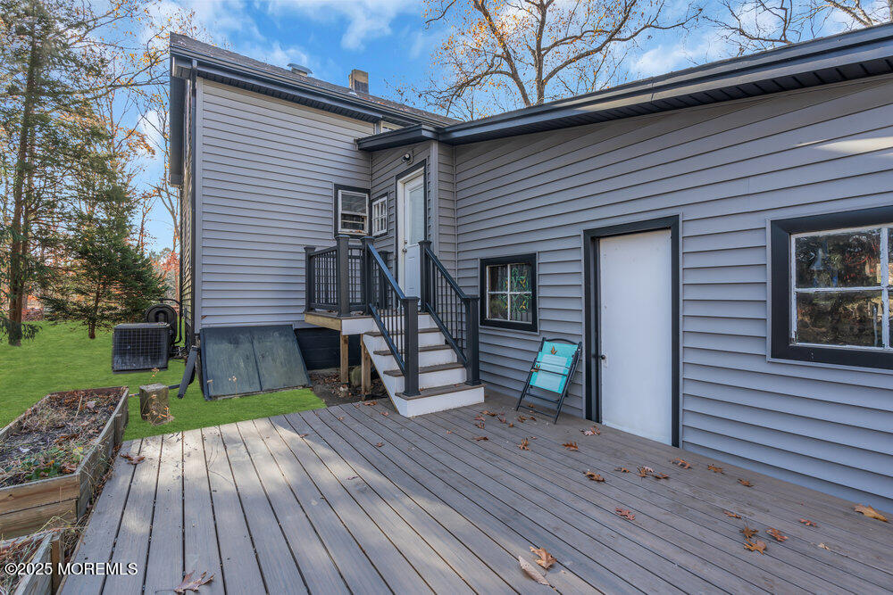 235 Perrineville Road Jackson, NJ 08527 - Photo 17 of 20 a view of a house with a patio