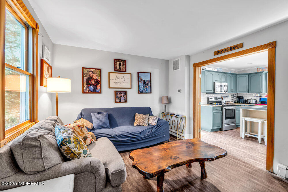 235 Perrineville Road Jackson, NJ 08527 - Photo 5 of 20 a living room with furniture and a wooden floor