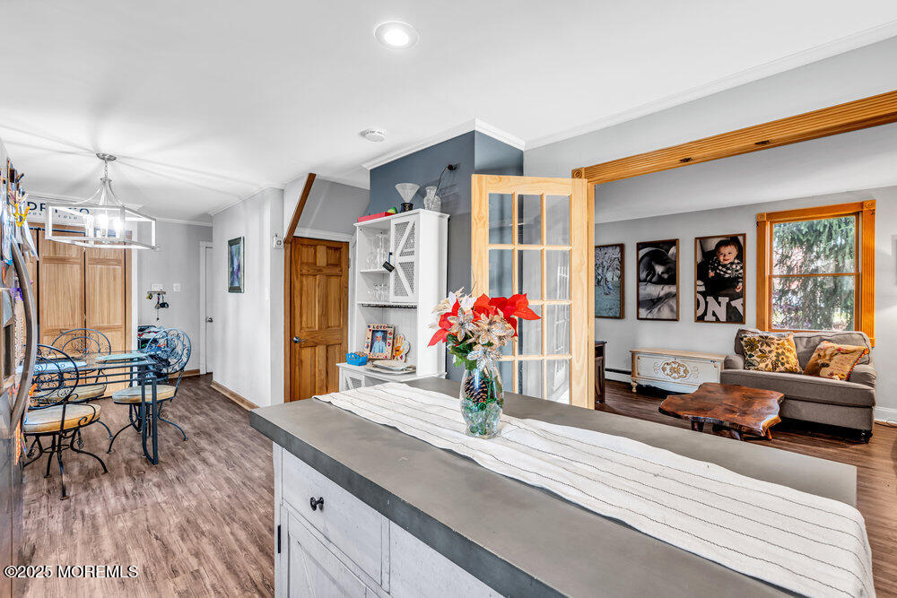 235 Perrineville Road Jackson, NJ 08527 - Photo 7 of 20 a living room with furniture and a potted plant