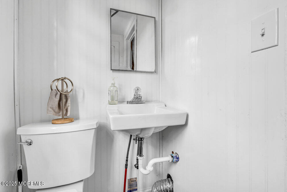 235 Perrineville Road Jackson, NJ 08527 - Photo 10 of 20 a bathroom with a sink toilet and mirror