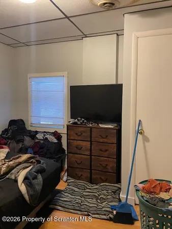 a room with furniture and a flat screen tv