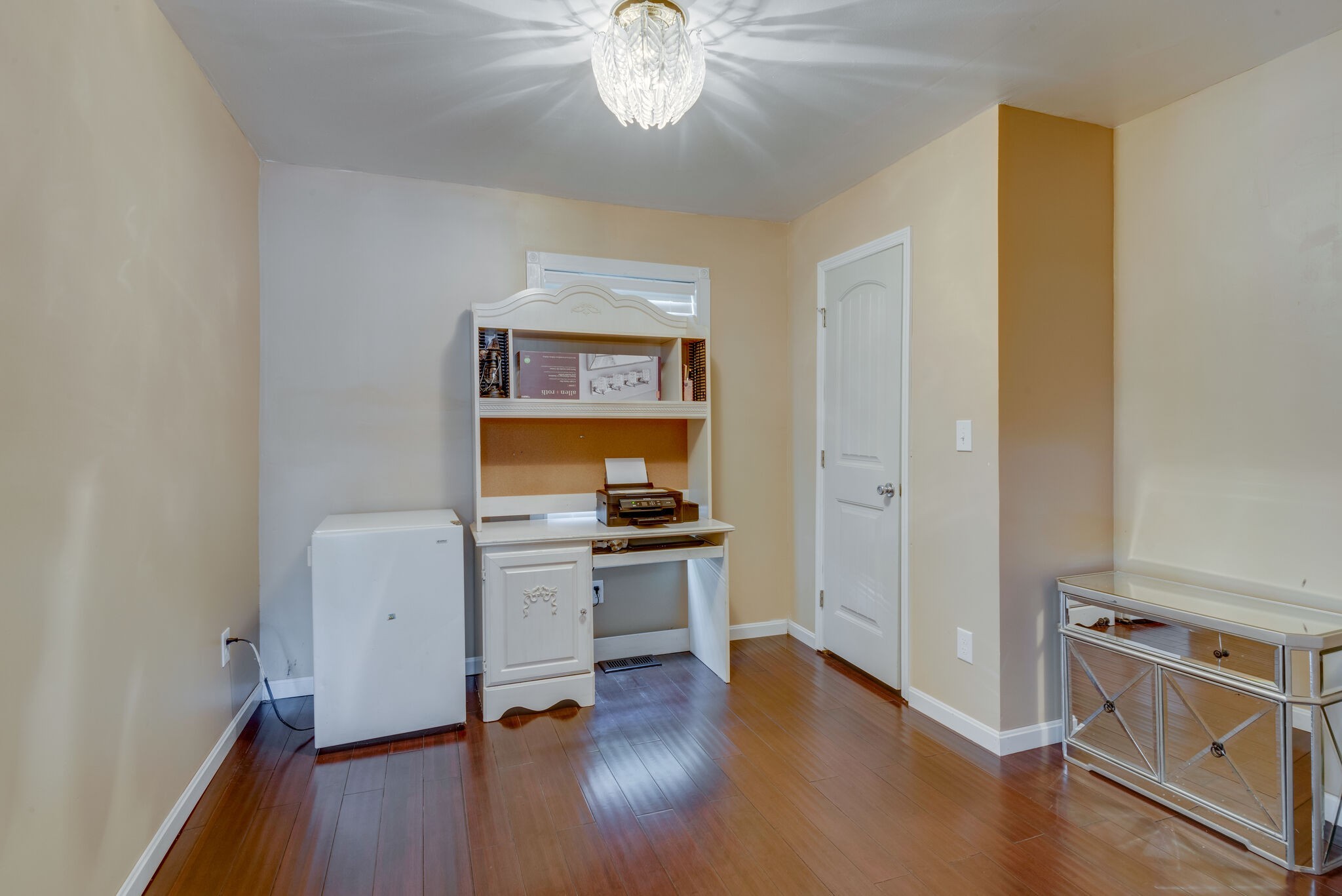 1532 Mohawk Trail Madison, TN 37115 - Photo 12 of 22 a room with a stove and wooden floor