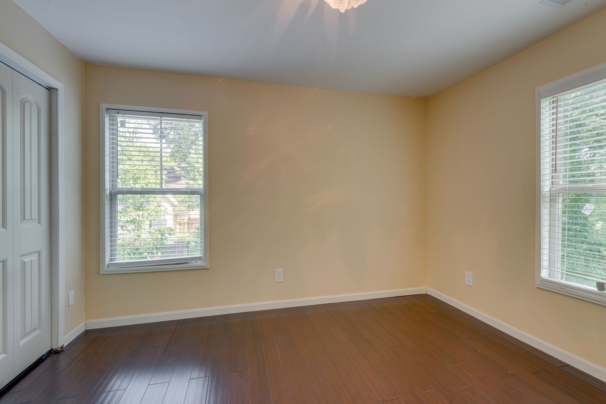 1532 Mohawk Trail Madison, TN 37115 - Photo 16 of 22 an empty room with wooden floor and windows