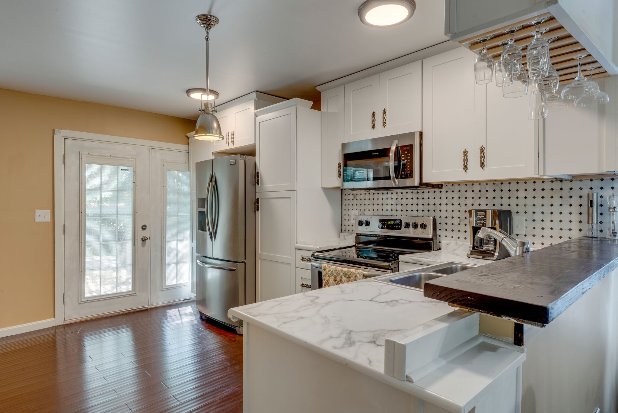 1532 Mohawk Trail Madison, TN 37115 - Photo 8 of 22 a kitchen with stainless steel appliances a stove microwave and refrigerator