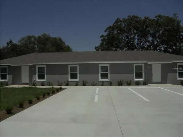 front view of a house with a garden