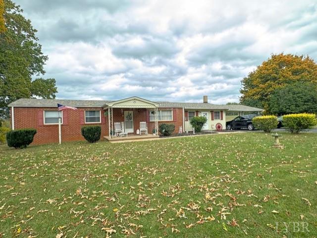6223 Joppa Mill Road Moneta, VA 24121 - Photo 26 of 55 a front view of a house with a garden