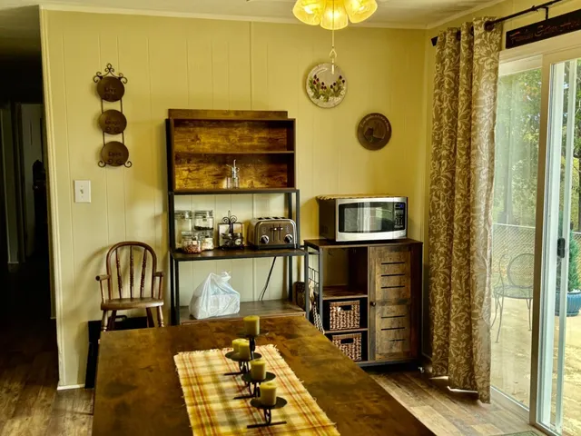 a living room with fireplace furniture and a flat screen tv