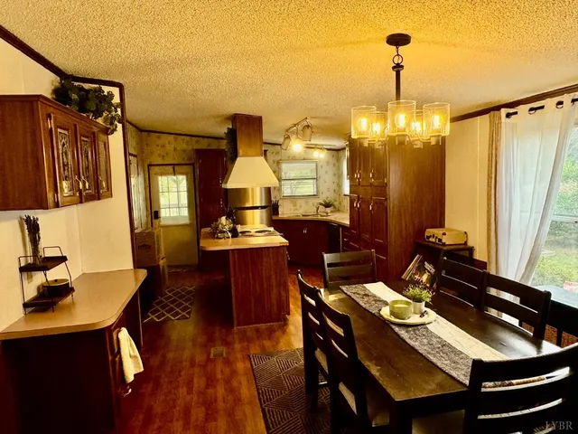 a view of a workspace with furniture and window