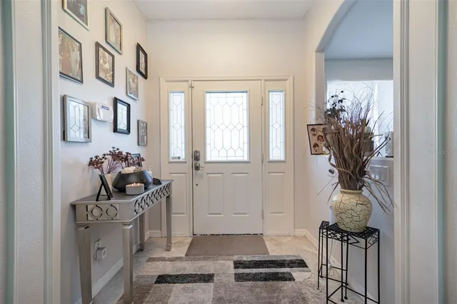 a vase of flowers sitting on a floor