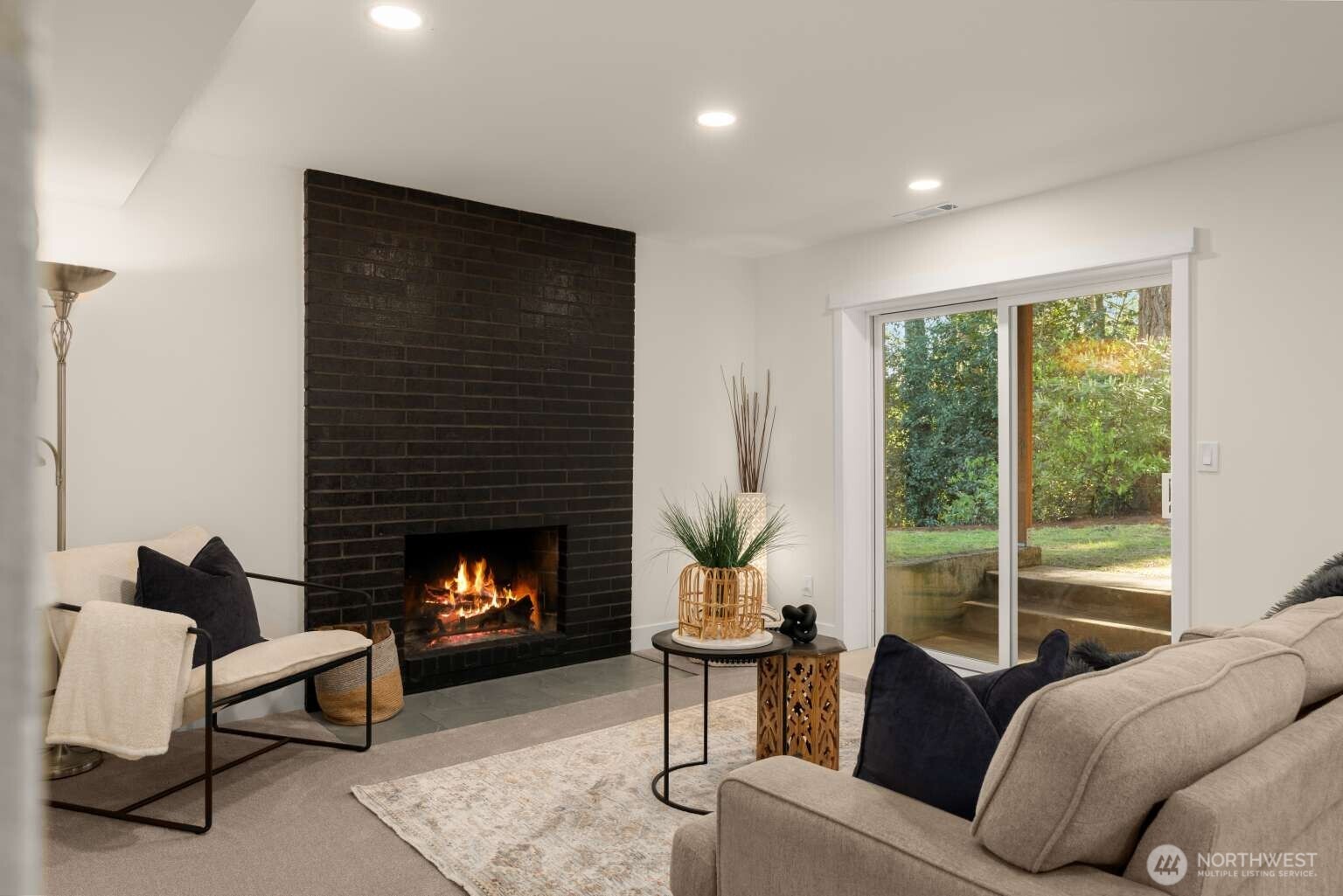 10811 Northeast 154th Court Bothell, WA 98011 - Photo 19 of 28 a living room with furniture and a fireplace