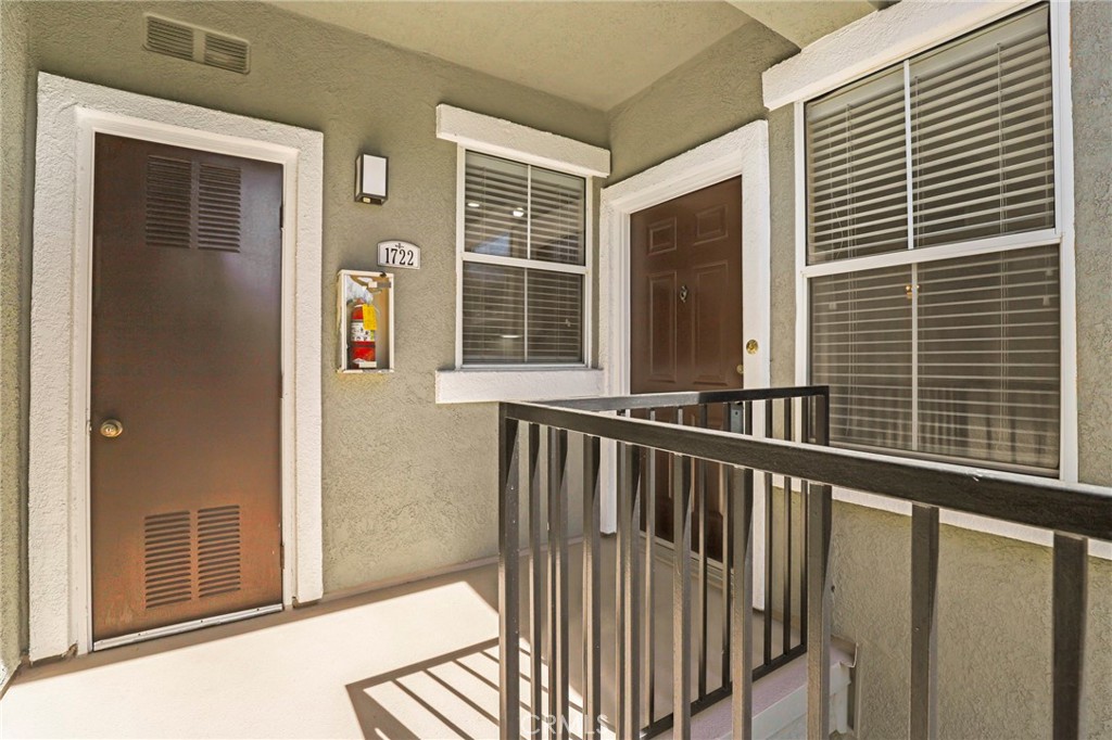 20000 Plum Canyon Road, Unit 1722 Saugus, CA 91350 - Photo 1 of 30 a view of a balcony with a window