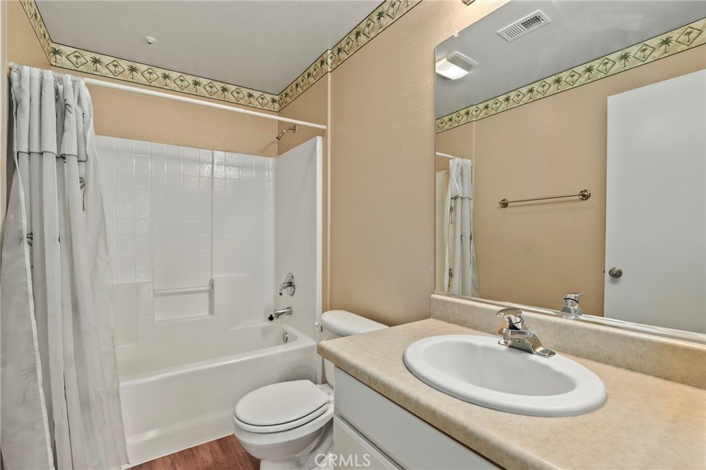 20000 Plum Canyon Road, Unit 1722 Saugus, CA 91350 - Photo 15 of 30 a bathroom with a sink a toilet and a mirror